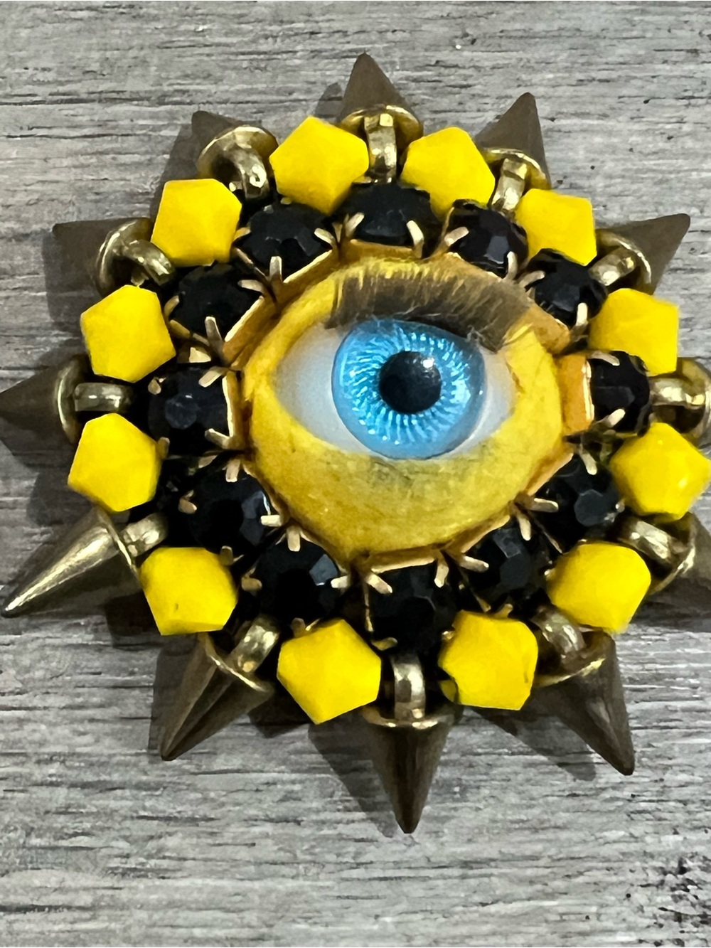 Yellow Eye Sunburst Accent Pin by Artists